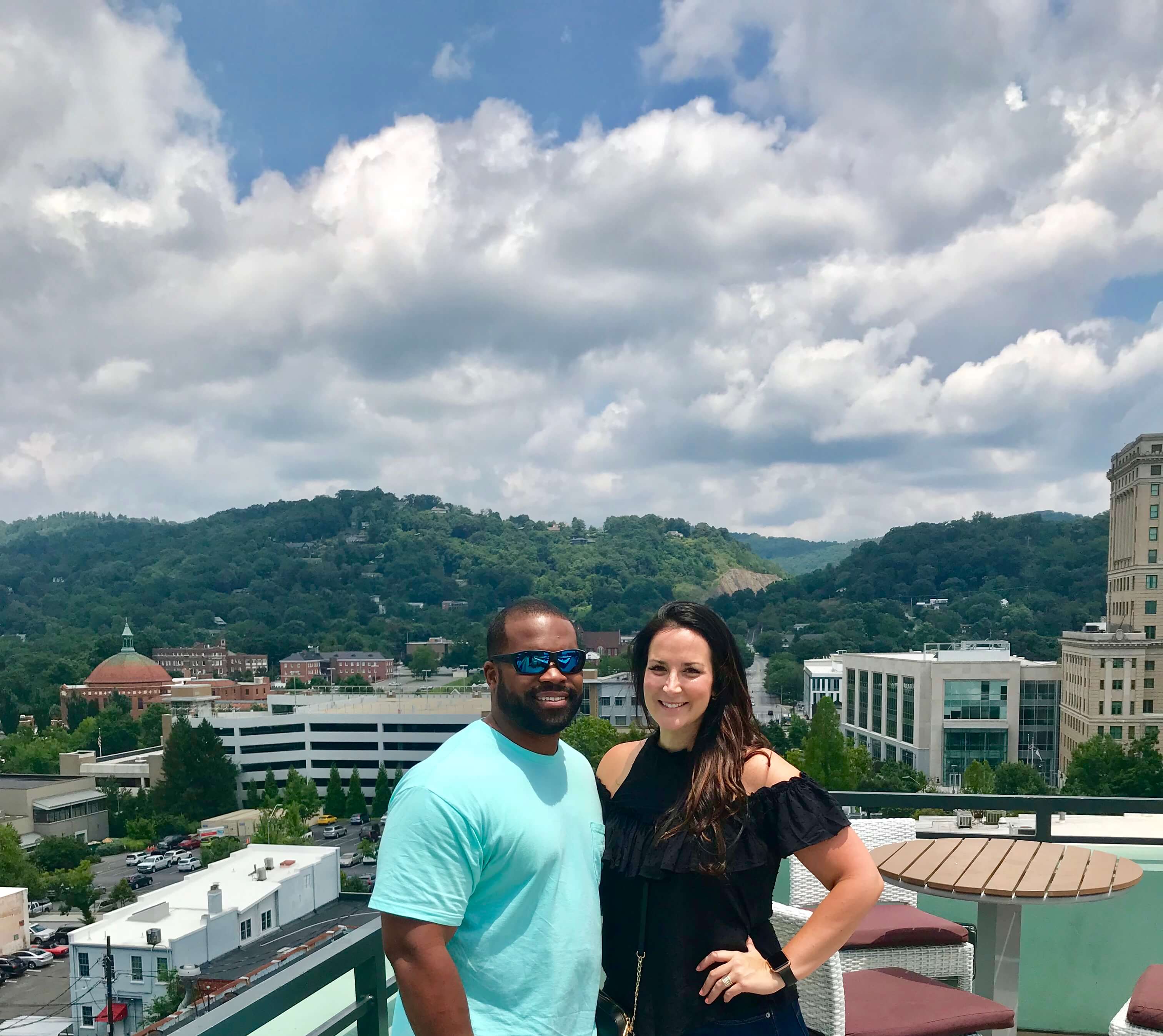 Couple possing in a hilly town