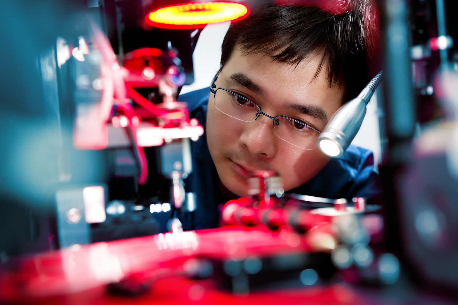 Technician examining components